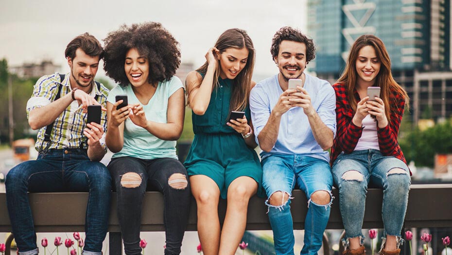 Group of people looking at their phones