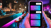 Sample text message over a bar/lounge setting background